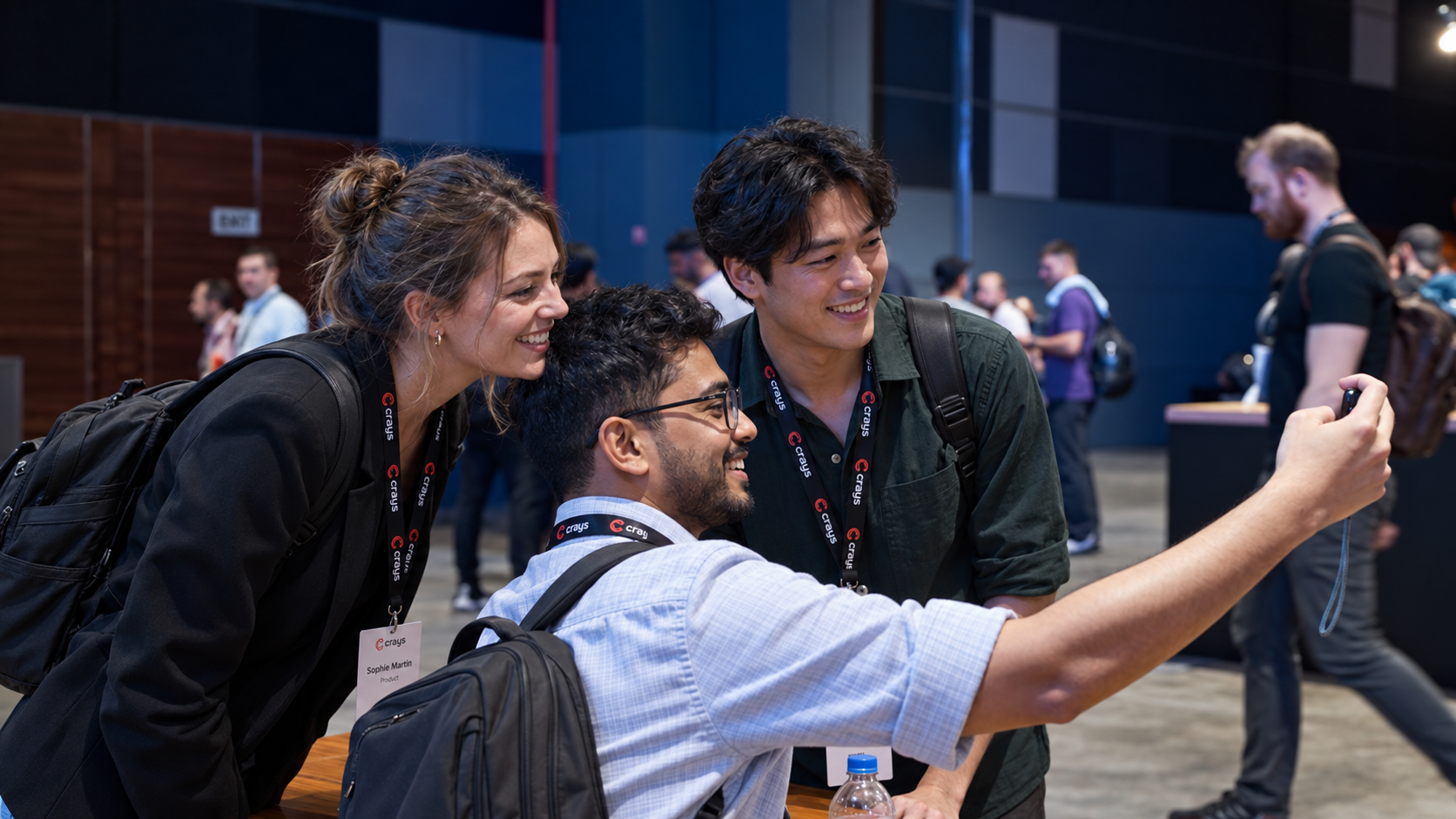 Three people sharing a cheerful moment at a community event